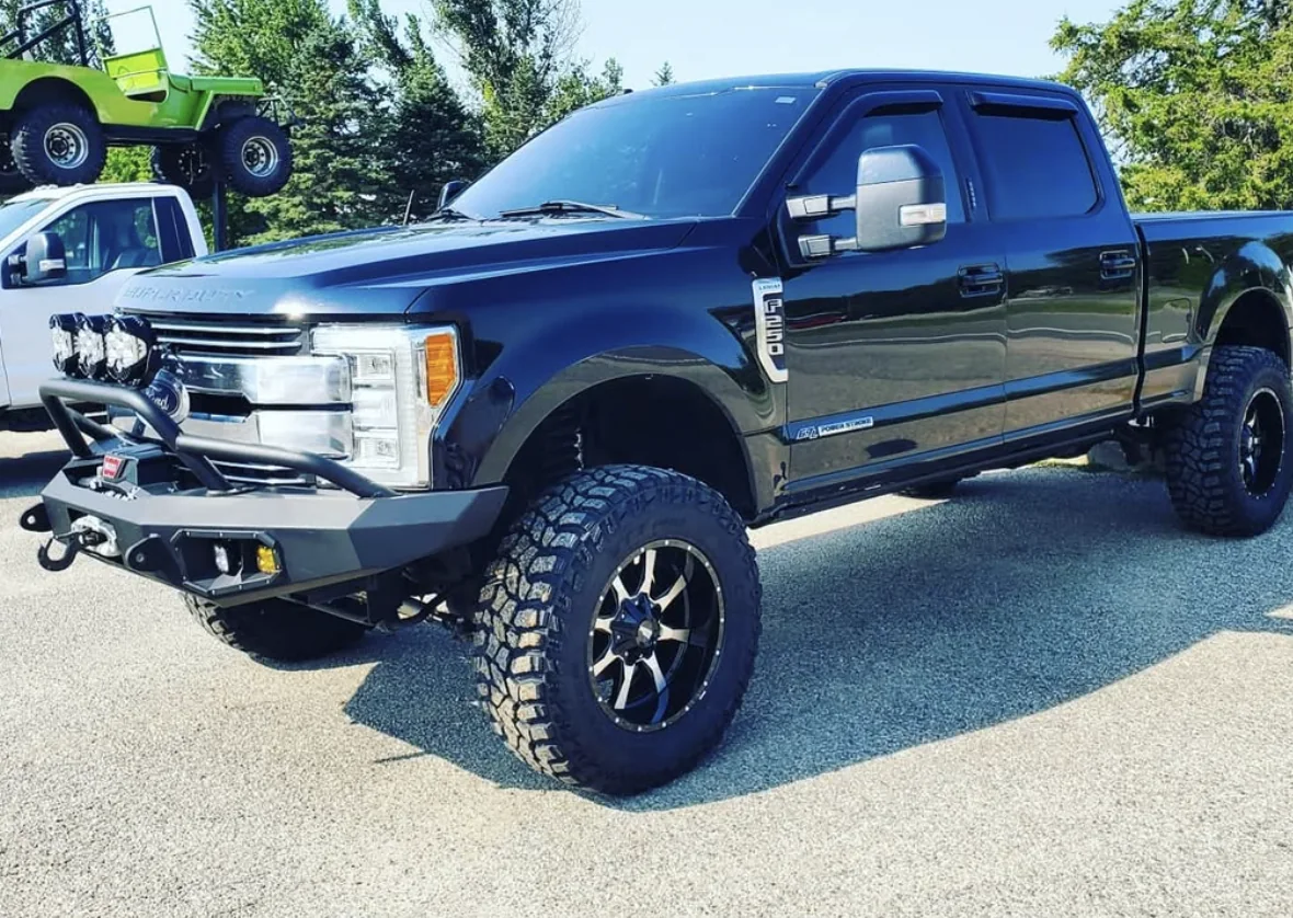Truck with aftermarket bumper and wheels